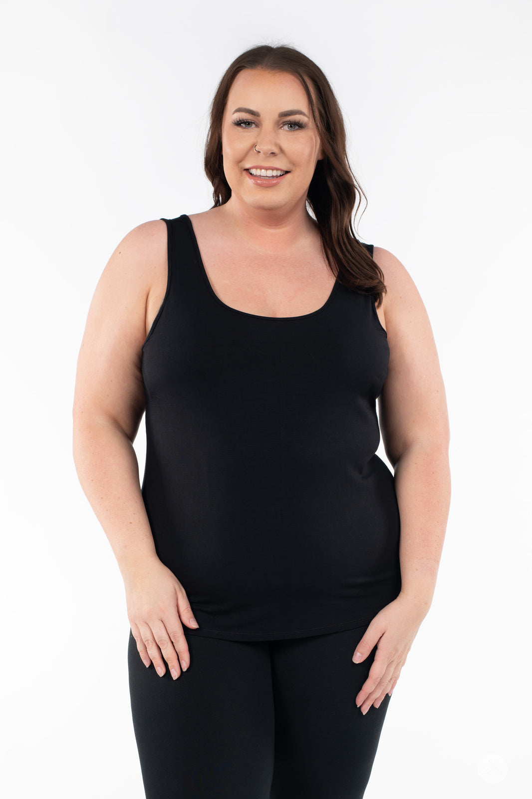 Plus-size woman smiling wearing SweetLegs Canada Classic Tank in black with black bottoms on white background