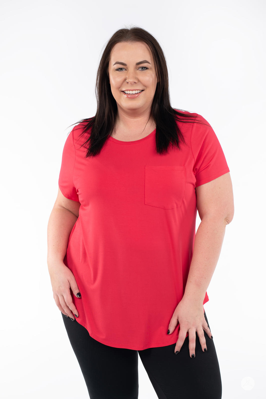 Plus size woman smiling wearing SweetTops Crew Neck Pocket Tee in bright red with short sleeves and relaxed fit