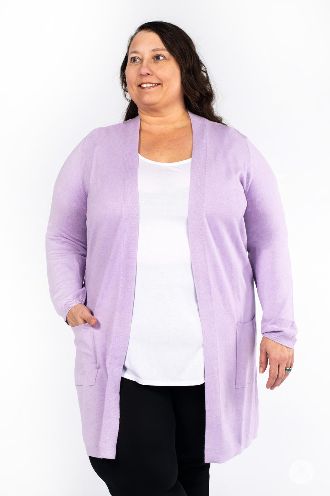 Woman wearing SweetLegs Canada Spring Cardigan in soft lavender with patch pockets over white top and black pants