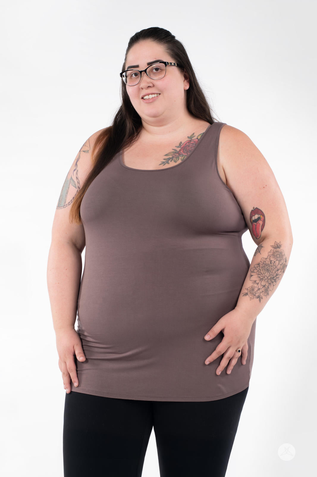 Plus-size woman smiling wearing SweetLegs Canada Classic Layering Tank in brown with black leggings on white background