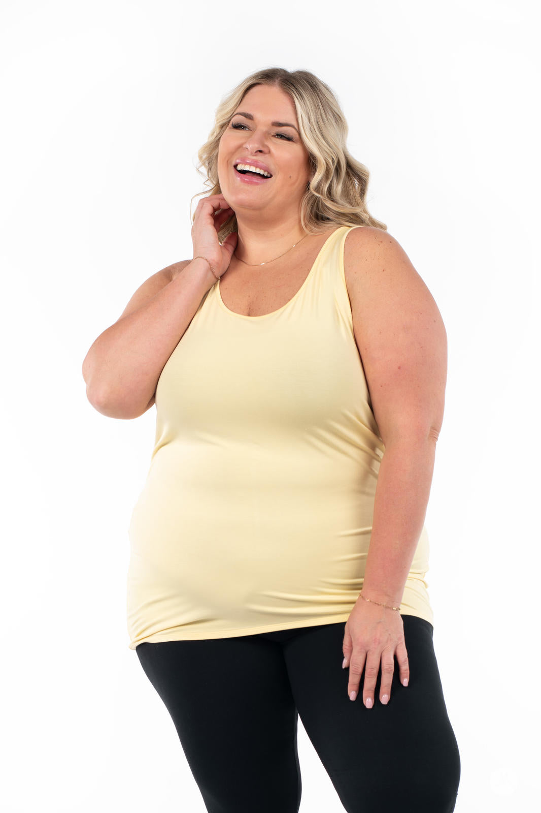 Plus-size woman wearing SweetLegs Canada Classic Layering Tank in soft yellow with a smooth, breathable fit on white background