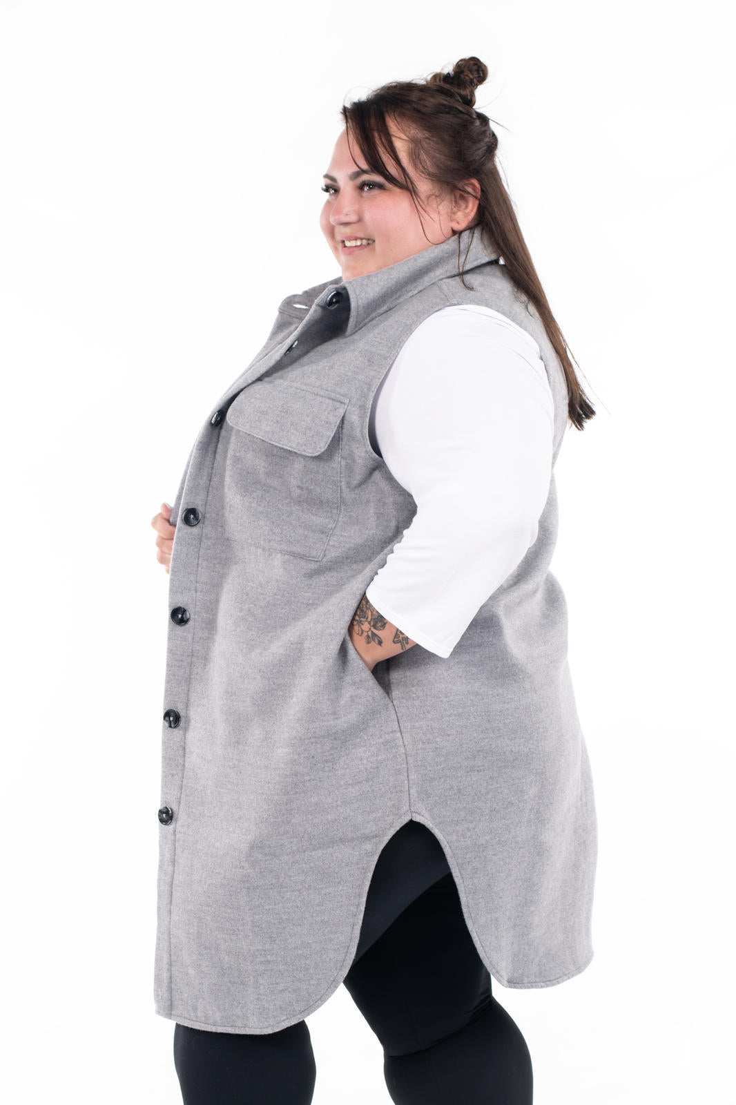 Plus size model wearing SweetLegs Canada Layering Shacket Vest in soft grey with button-up front and flap pockets