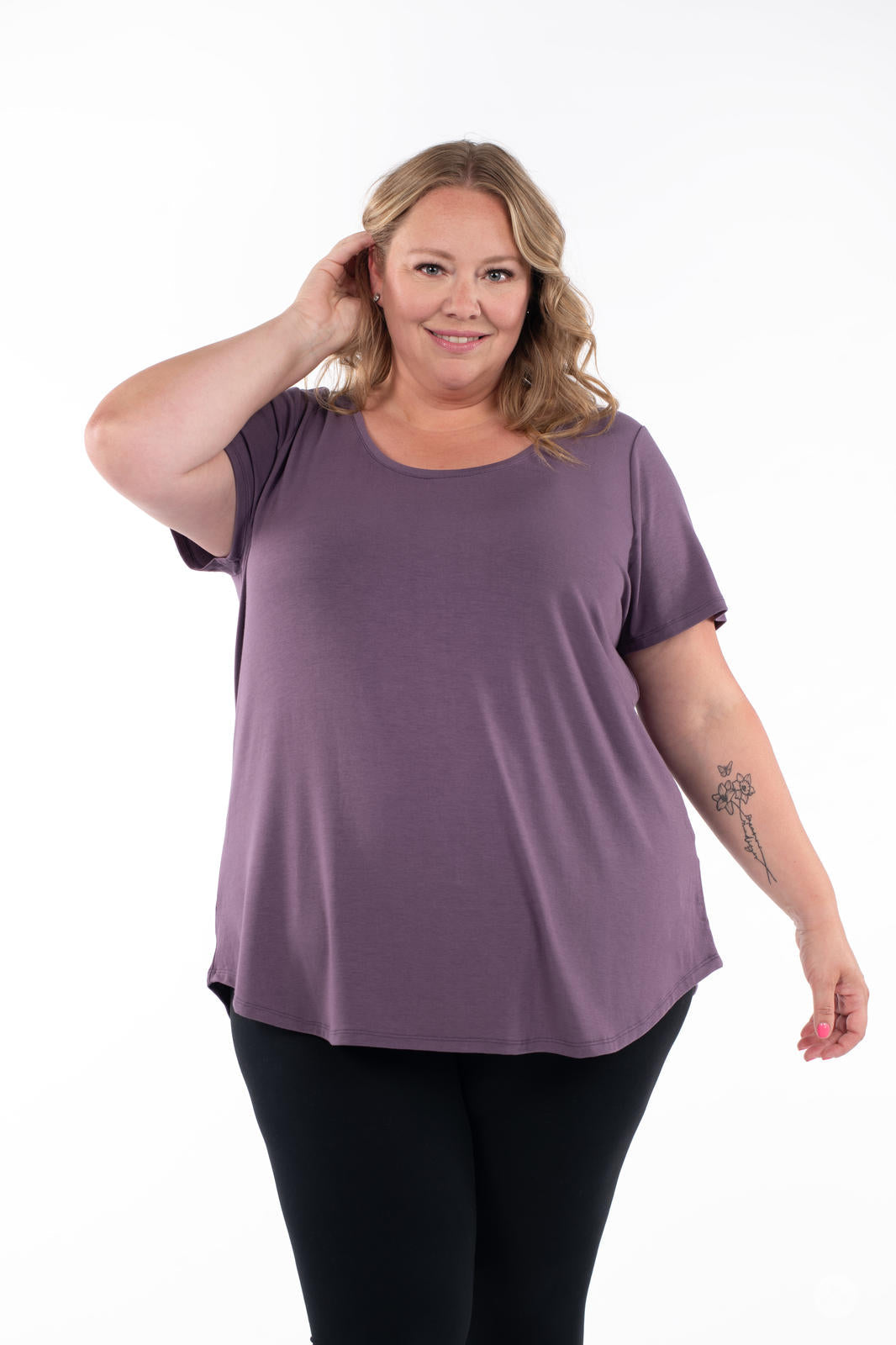 Plus-size model wearing SweetLegs Canada Scoop Neck Tee in soft purple with scoop neckline and gentle flare front view