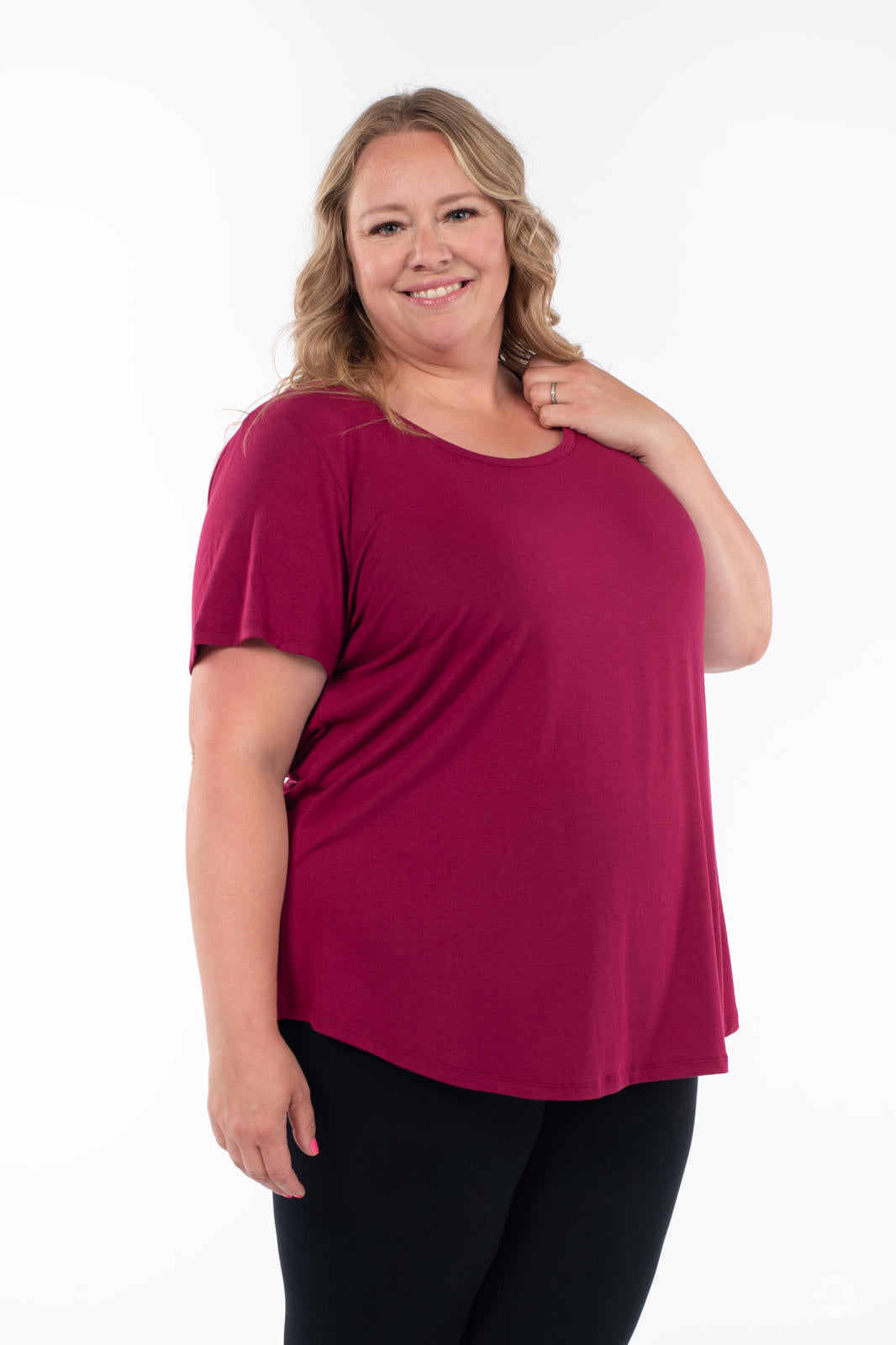 Smiling plus-size woman wearing SweetLegs Canada Scoop Neck Tee in rich berry tone with short sleeves front view