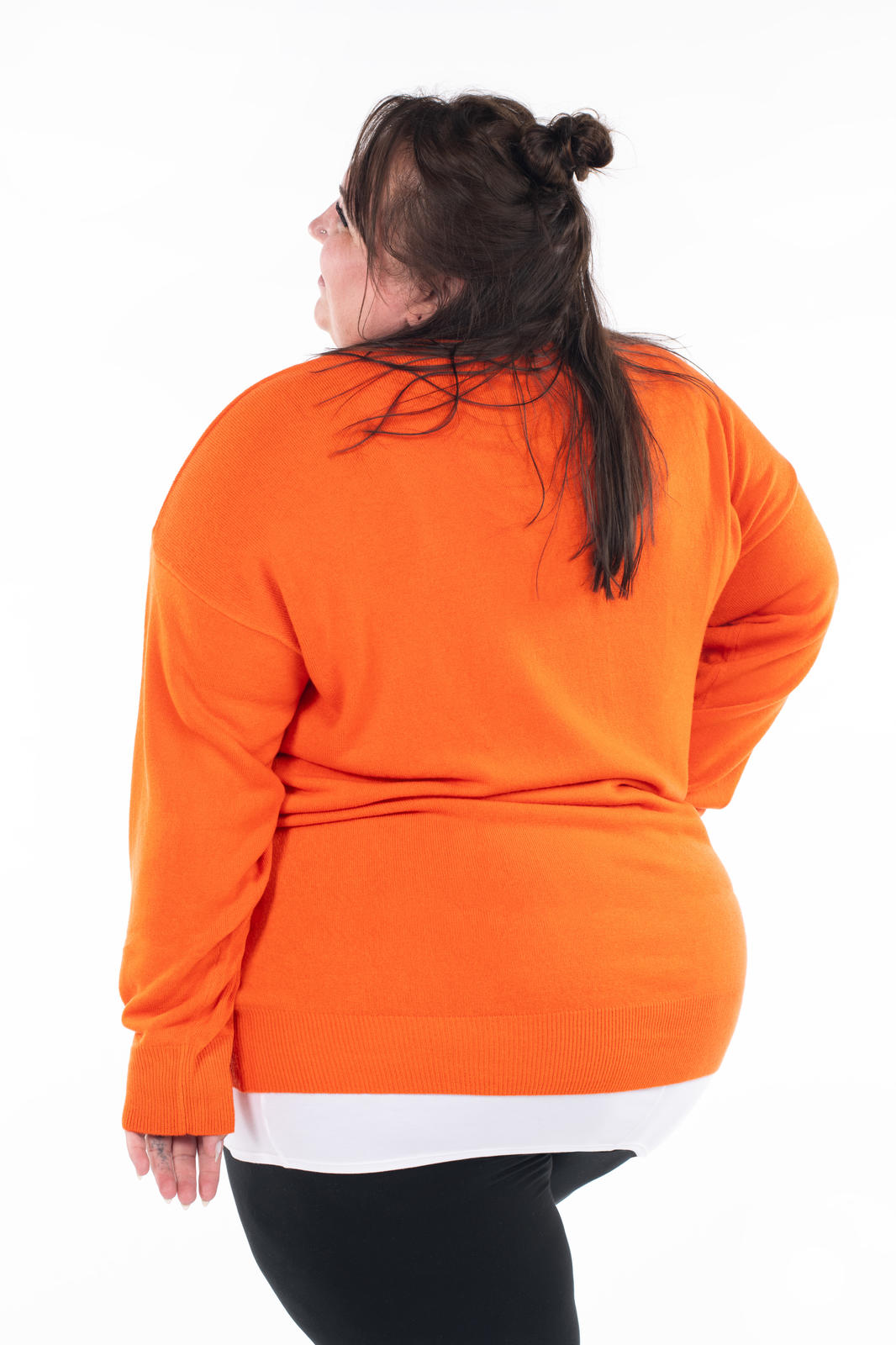Plus size woman modeling SweetTops Soft Knit V-Neck Sweater in vibrant autumn orange, relaxed fit shown from the back