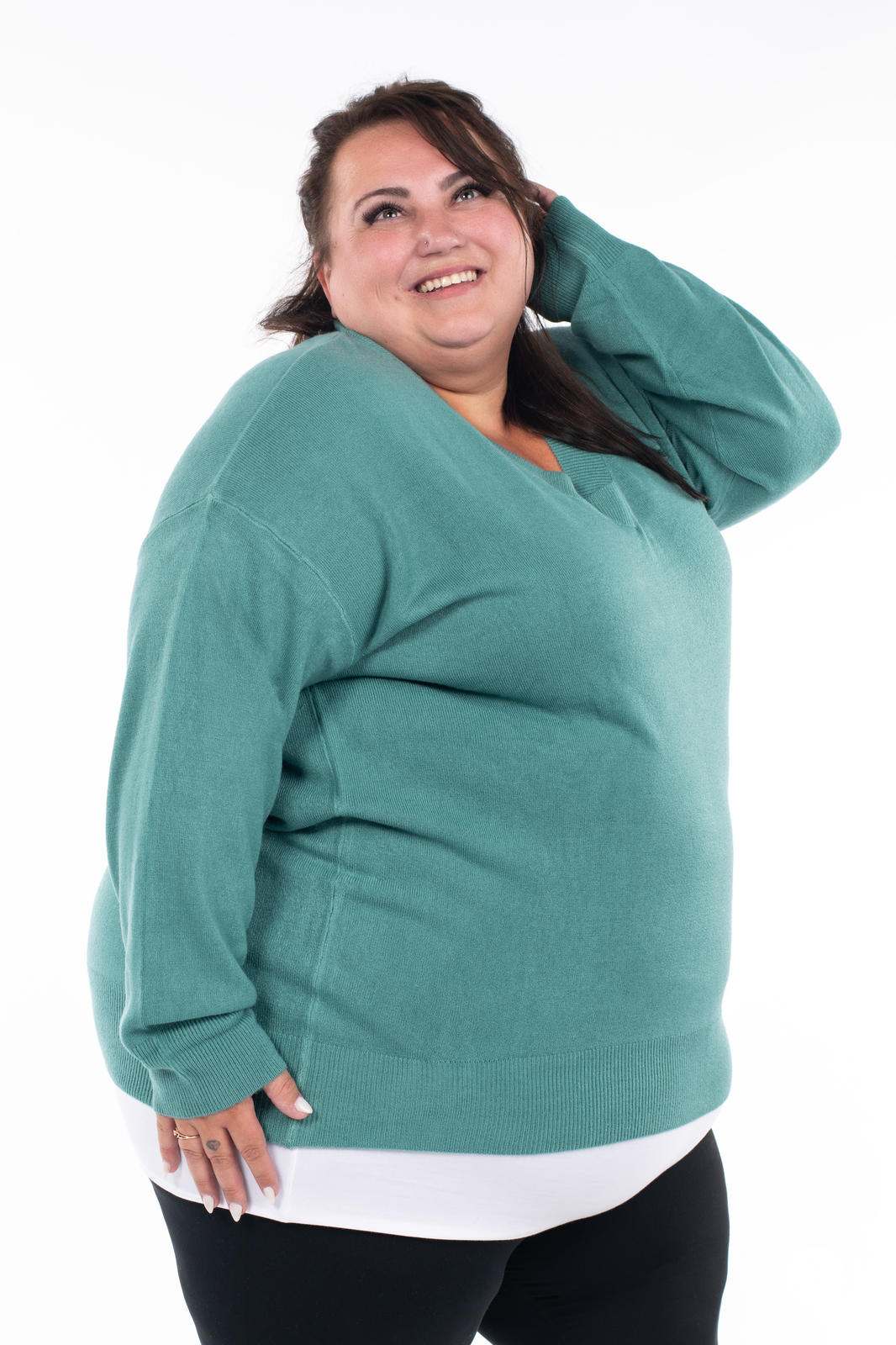 Plus size model wearing SweetTops Soft Knit V-Neck Sweater in dusty teal with relaxed fit and ribbed cuffs and hem