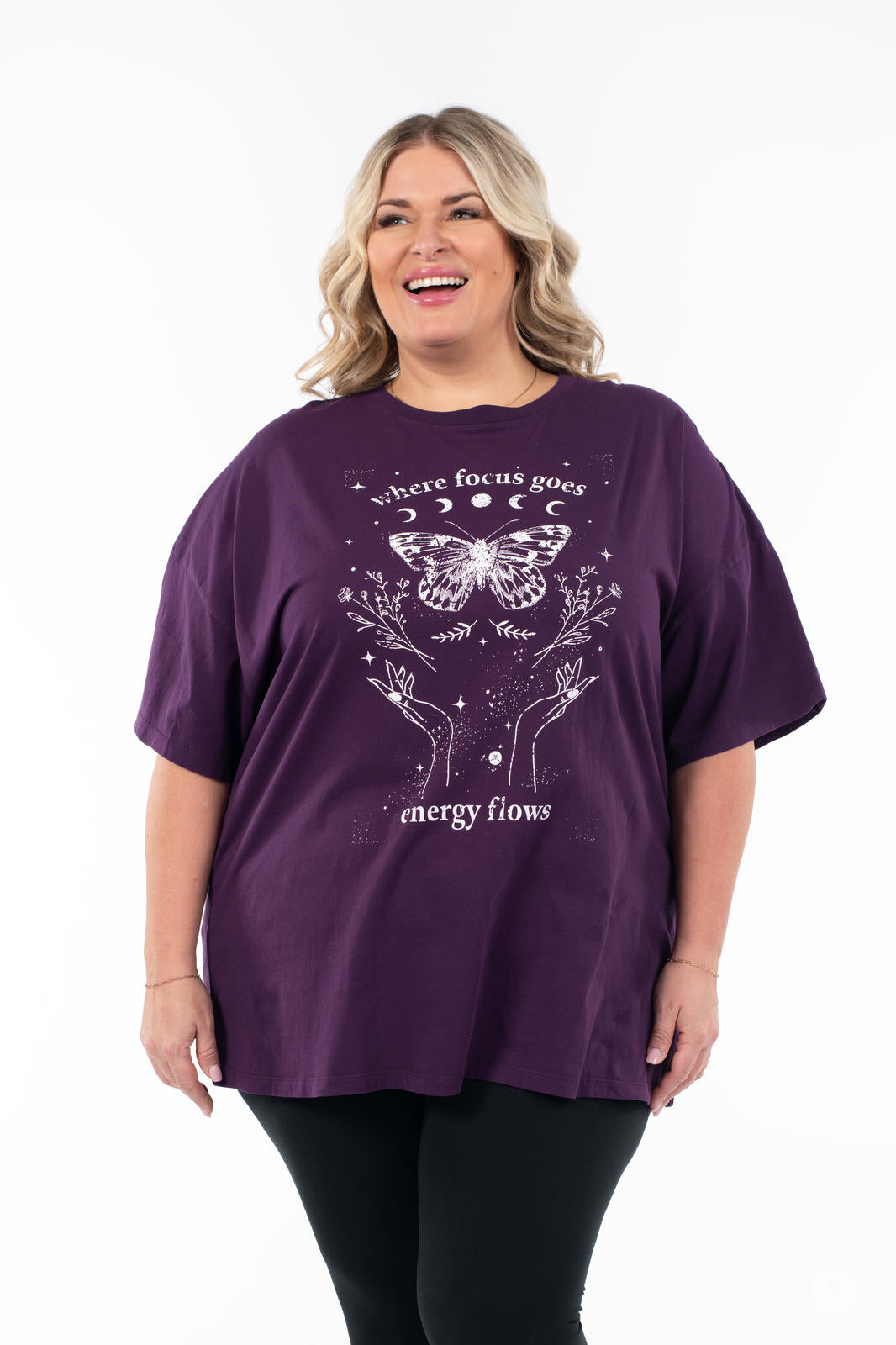 Woman wearing SweetTops Vintage Graphic Tee in purple with butterfly, floral art, and inspirational text on front