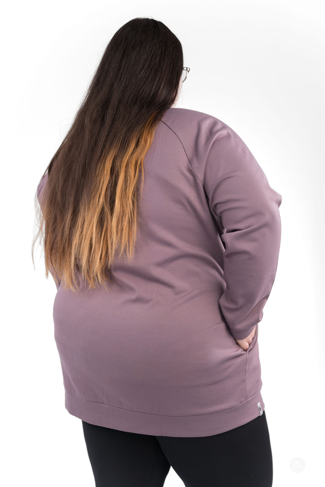 Plus-size model showing back of mauve Basic Raglan Pullover by SweetLegs Canada with hand in pocket, relaxed fit