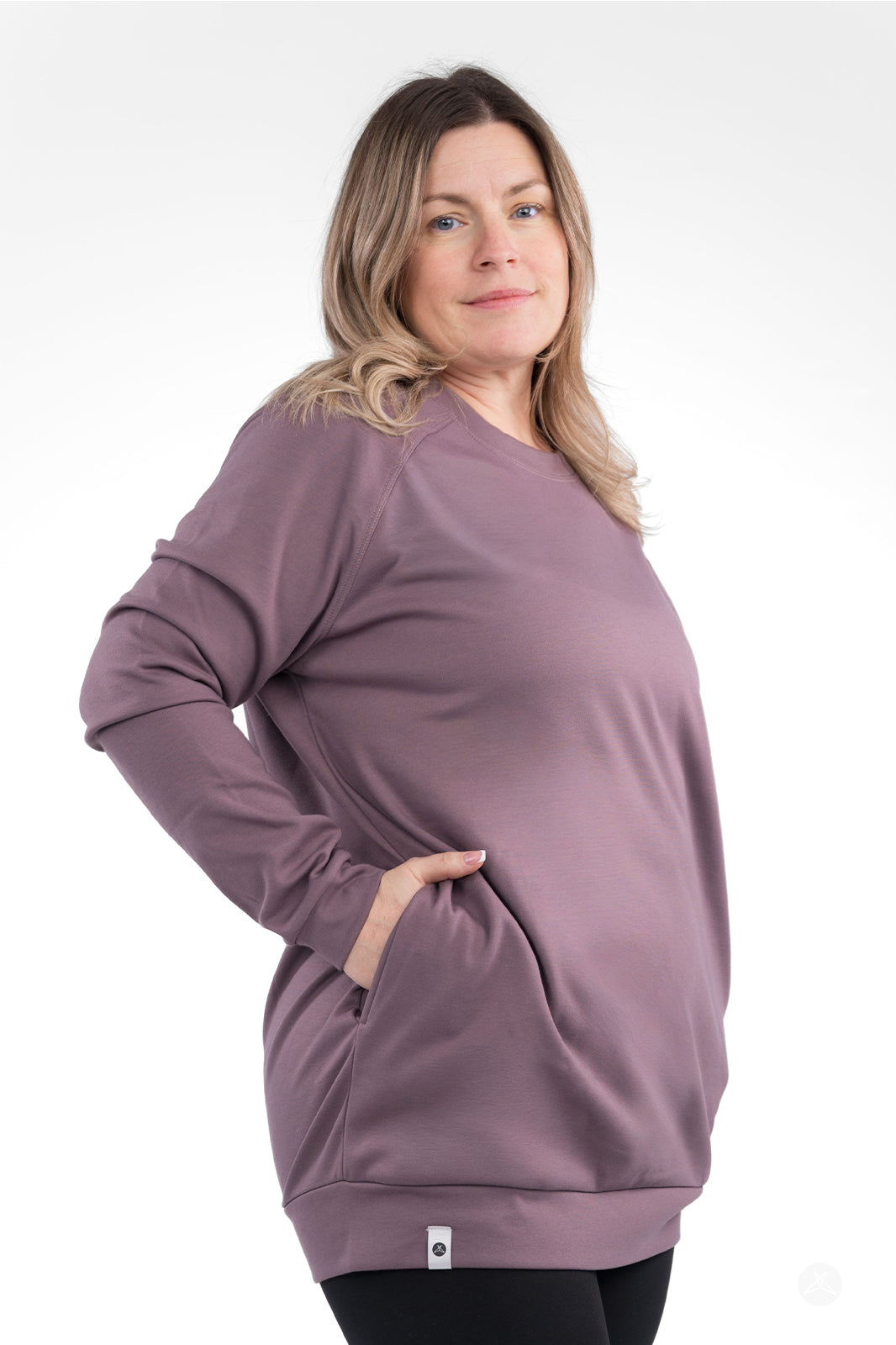 Side view of plus-size woman wearing mauve Basic Raglan Pullover by SweetLegs Canada with hand in pocket
