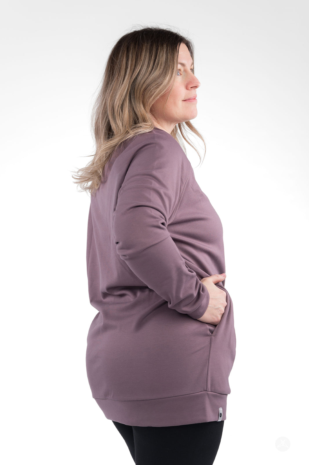 Side view of a woman in mauve Basic Raglan Pullover by SweetLegs Canada with hand tucked in pocket