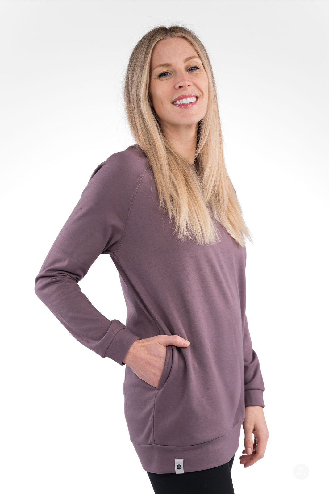 Side profile of woman in mauve Basic Raglan Pullover with pocket by SweetLegs Canada smiling confidently