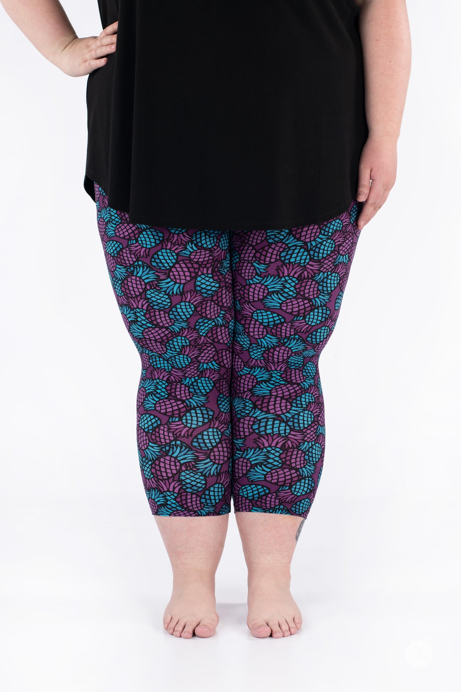 Front view of SweetLegs Razzle Dazzle Crops with turquoise and purple pineapple pattern on cropped leggings