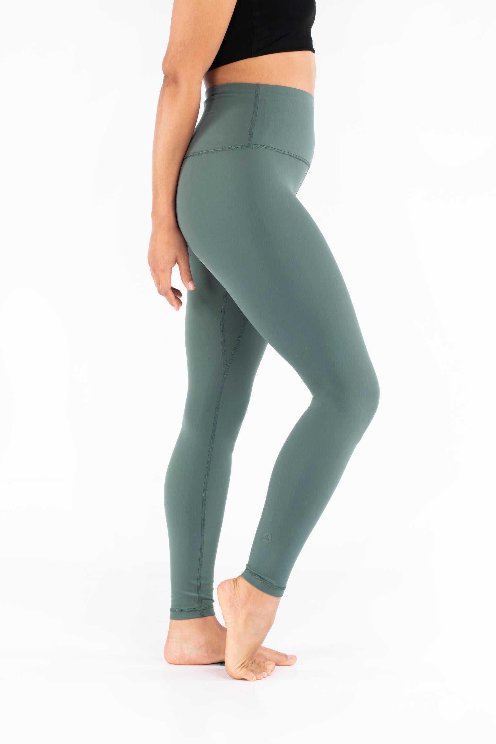 Side view of barefoot model wearing green Free Motion Leggings from SweetLegs Athleisure with high waistband