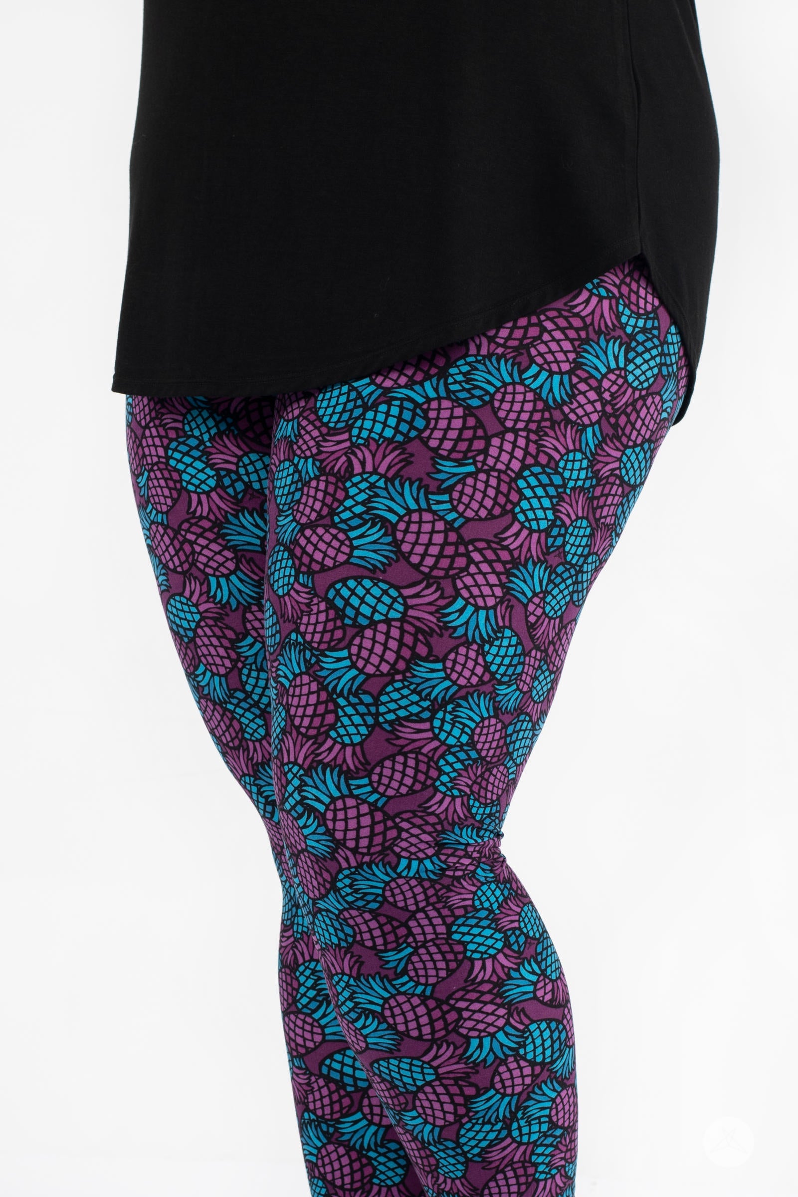 SweetLegs Razzle Dazzle Crops featuring purple and teal pineapple pattern on fitted cropped leggings side view