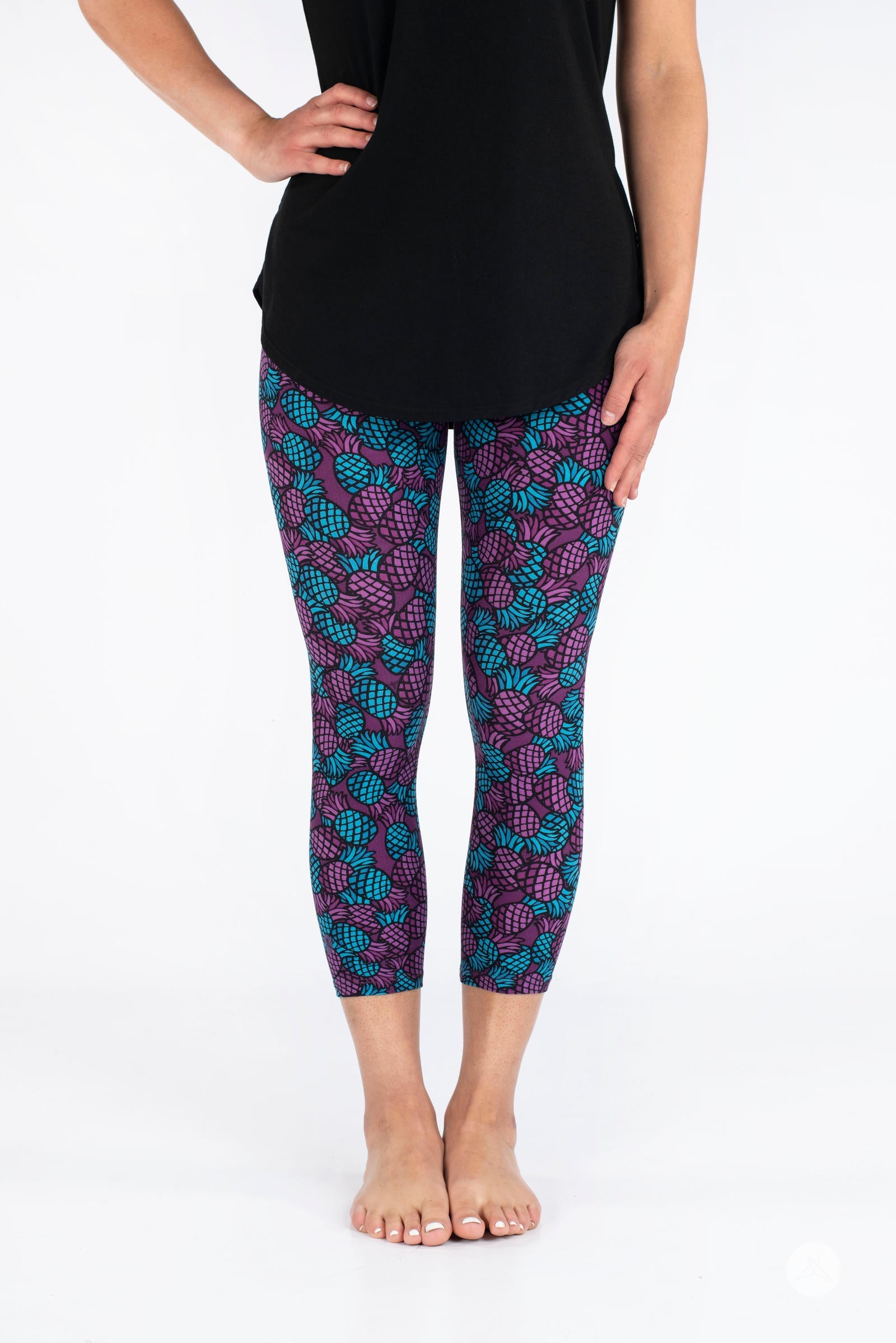 Front view of SweetLegs Razzle Dazzle Crops with purple and teal pineapple print on cropped leggings