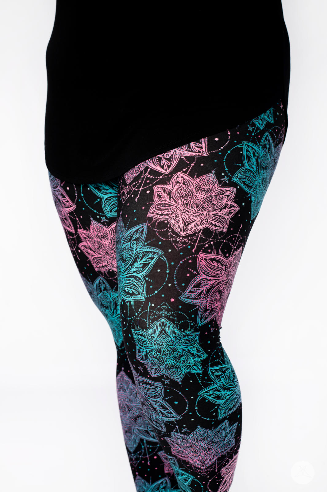 Close-up side view of SweetLegs Everafter Crops with intricate pink and blue floral geometric design on black background