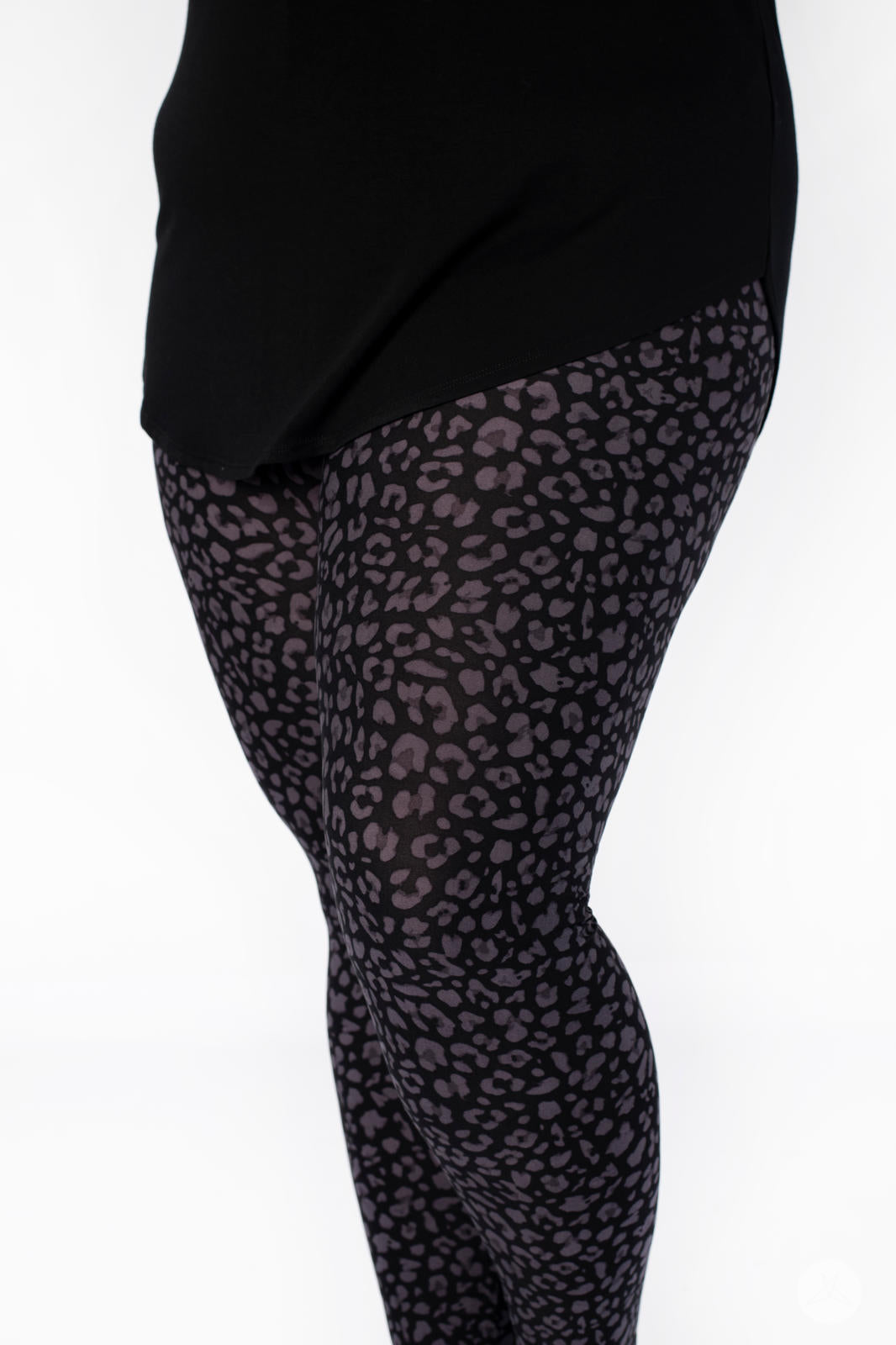 Shadow Hunter leggings by SweetLegs with scaled grey cheetah print on black fabric, shown on model’s legs