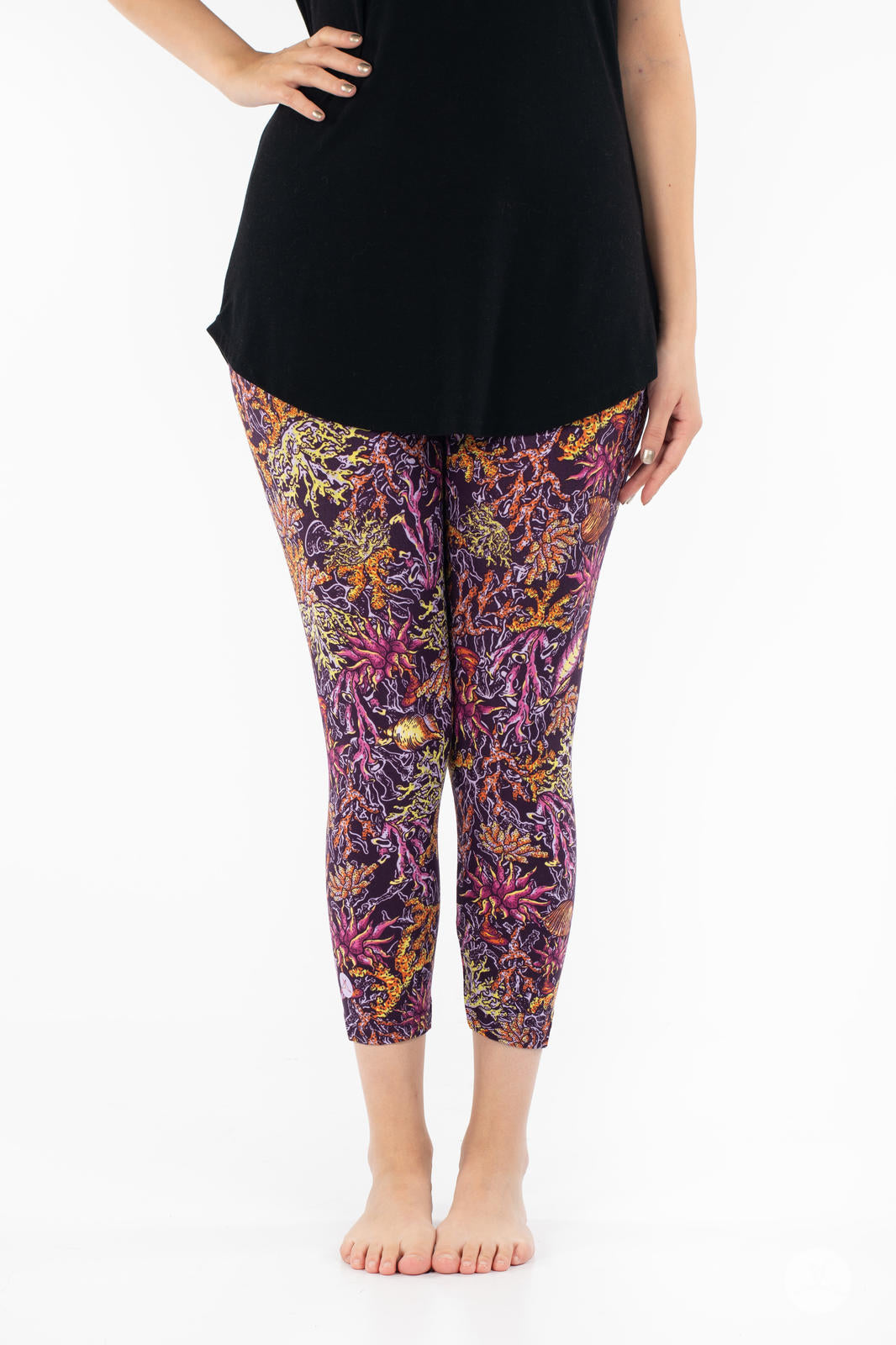 Front view of SweetLegs Coral Cove Crops with vibrant sea life pattern cropped above the ankle for warm weather comfort