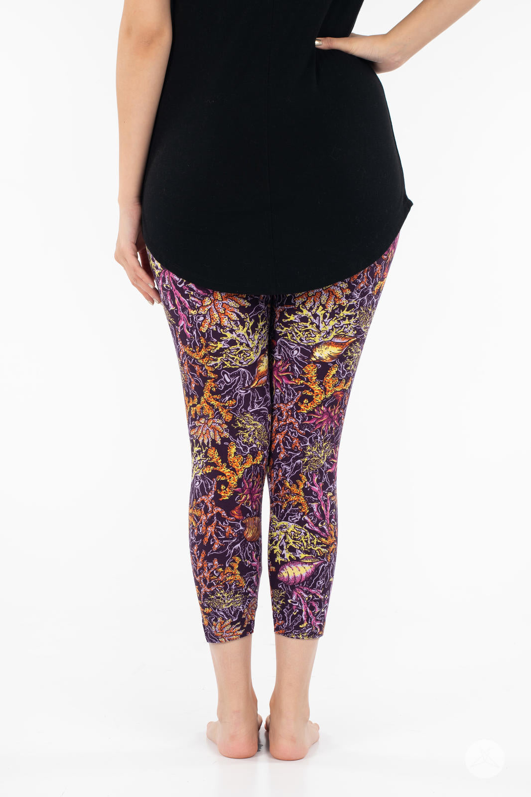 Rear view of SweetLegs Coral Cove Crops with vibrant coral reef design cropped above the ankle for warm weather wear