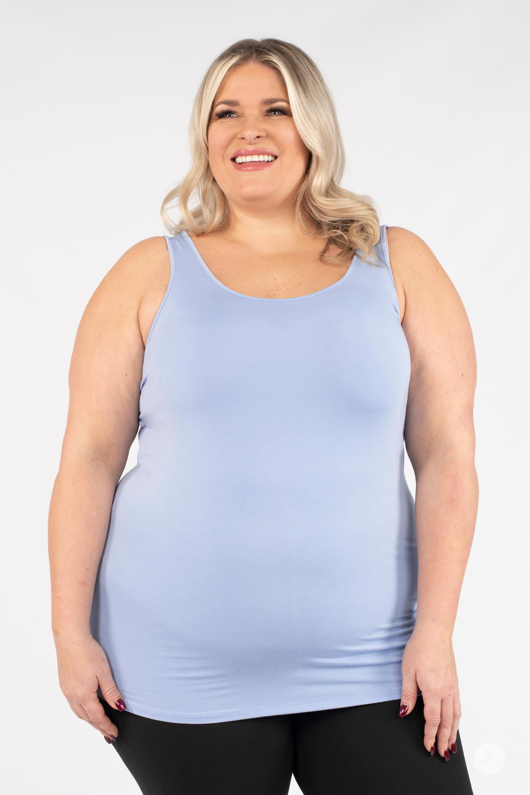 Plus-size model smiling wearing SweetLegs Canada Classic Layering Tank in soft blue with a smooth fit on white background