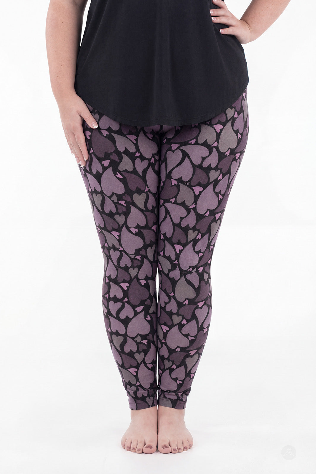 Front view of SweetLegs Heartstorm leggings with moody plum and charcoal heart pattern in a full-length fit
