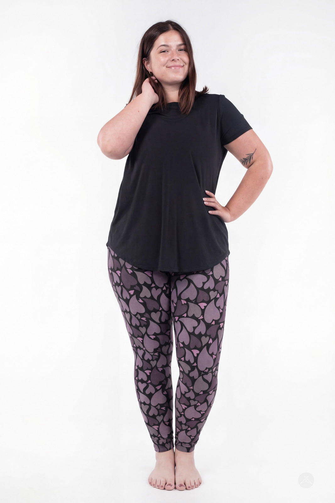 Front view of SweetLegs Heartstorm leggings with plum and charcoal heart pattern and comfortable full-length fit