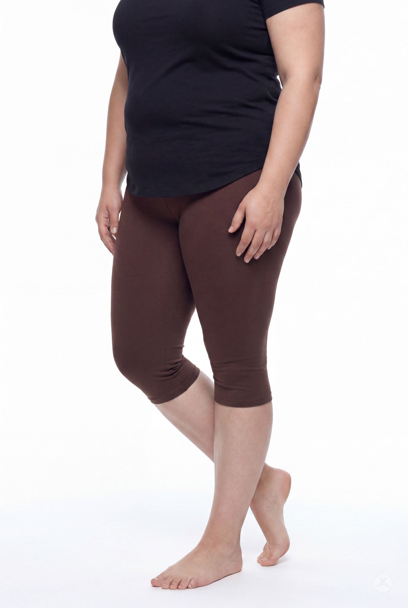 Person wearing SweetLegs Knee-Length Capri in walnut brown paired with black top, standing barefoot on white background