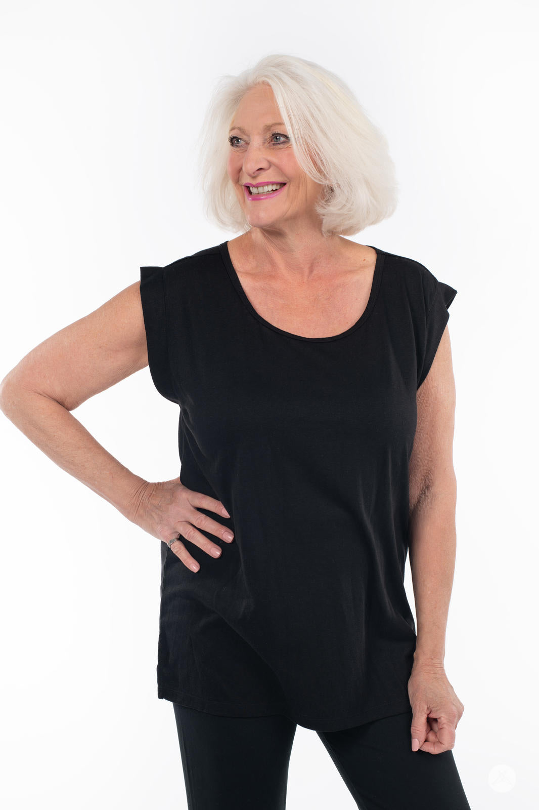 Mature woman smiling wearing black Cap Sleeve Scoop Neck Tee by SweetTops with hands on hips posing confidently