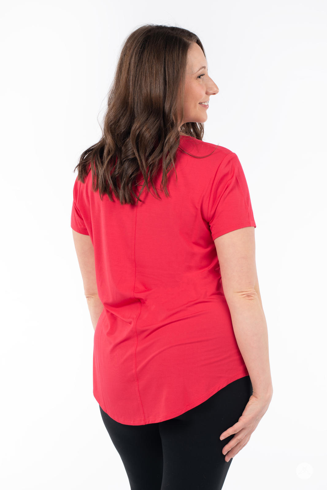 Woman showing back view in SweetTops Crew Neck Pocket Tee in vibrant red with a relaxed fit and soft fabric design