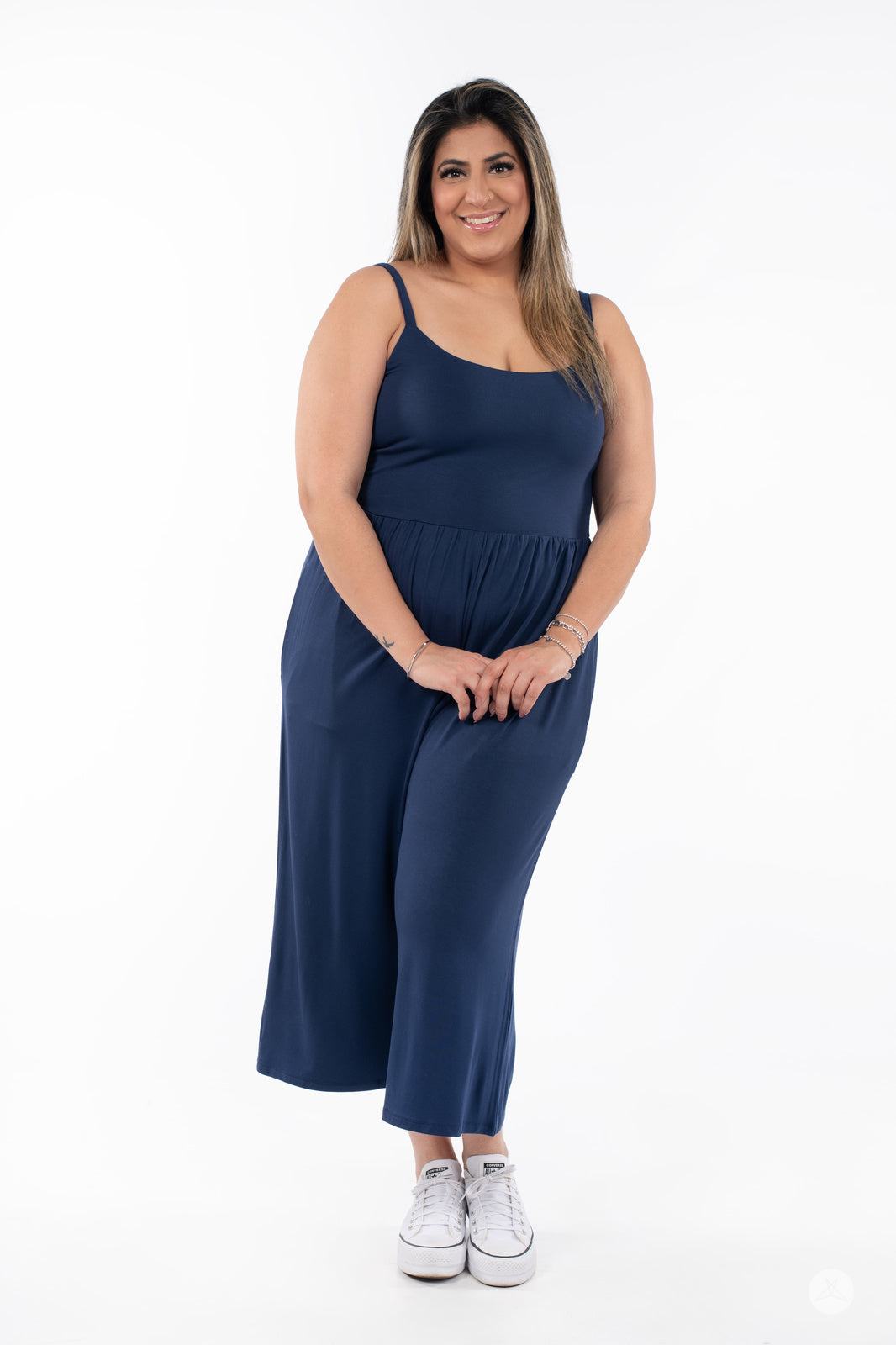 Smiling woman wearing navy blue SweetLegs Cropped Wide Leg Jumpsuit with thin straps and relaxed fit front view