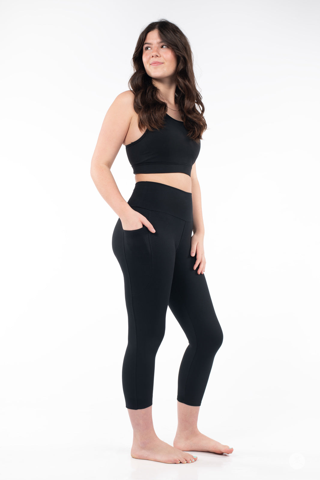 SweetLegs High-Waist Pocket Crops in black modeled with a hand in the pocket