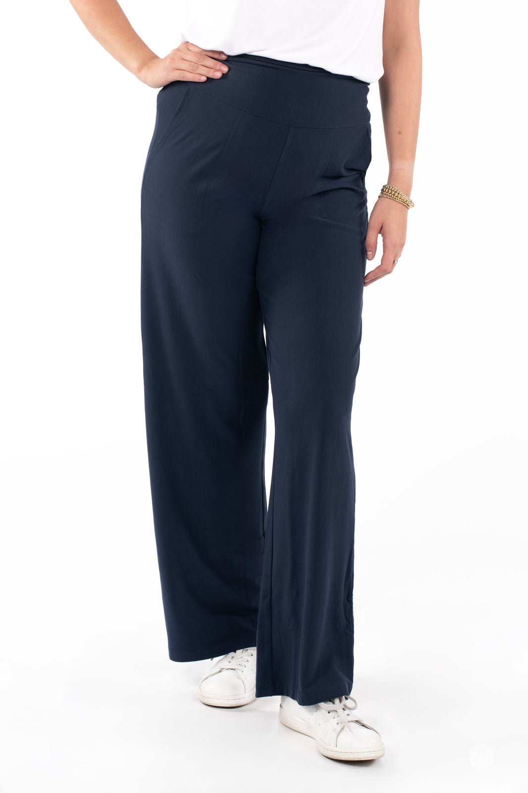Woman wearing SweetLegs High-Waist Wide Leg Pants in navy paired with white sneakers for a casual look