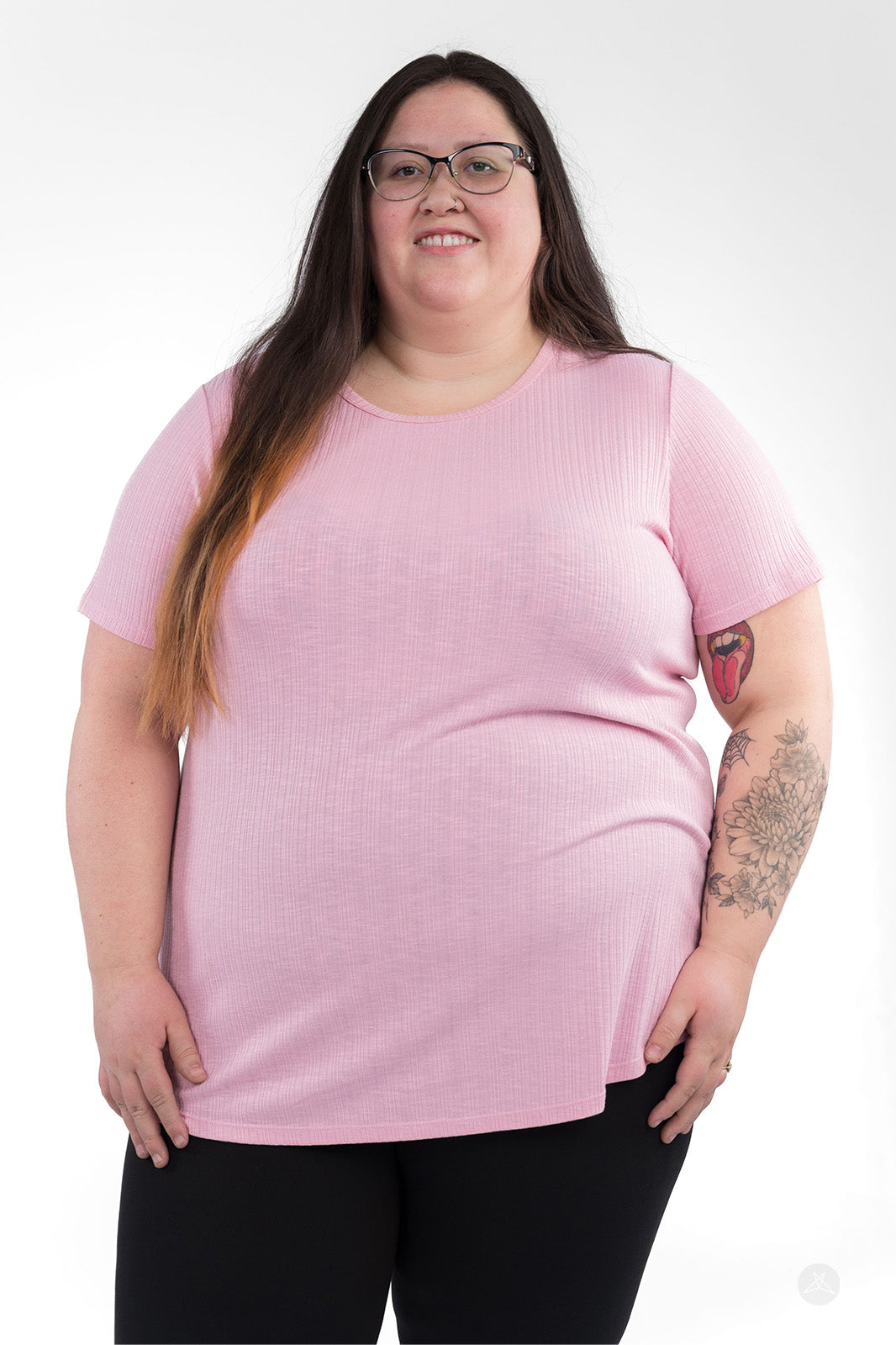 Plus-size woman wearing light pink The Soft Ribbed Tee by SweetLegs Canada with crew neckline and short sleeves front view