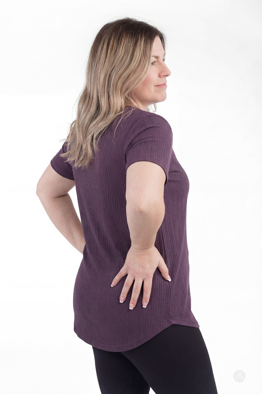 Rear view of woman wearing purple The Soft Ribbed Tee by SweetLegs Canada with short sleeves and rib-knit fabric