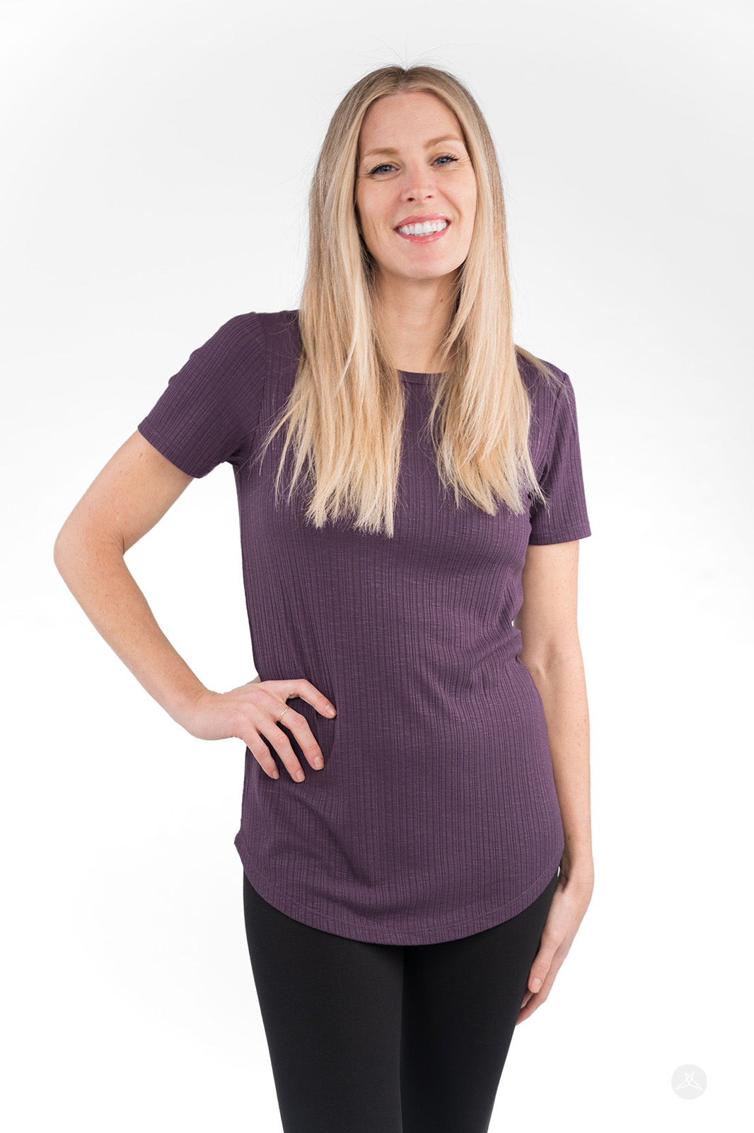 Woman wearing purple The Soft Ribbed Tee by SweetLegs Canada with crew neck and curved hem, smiling front view