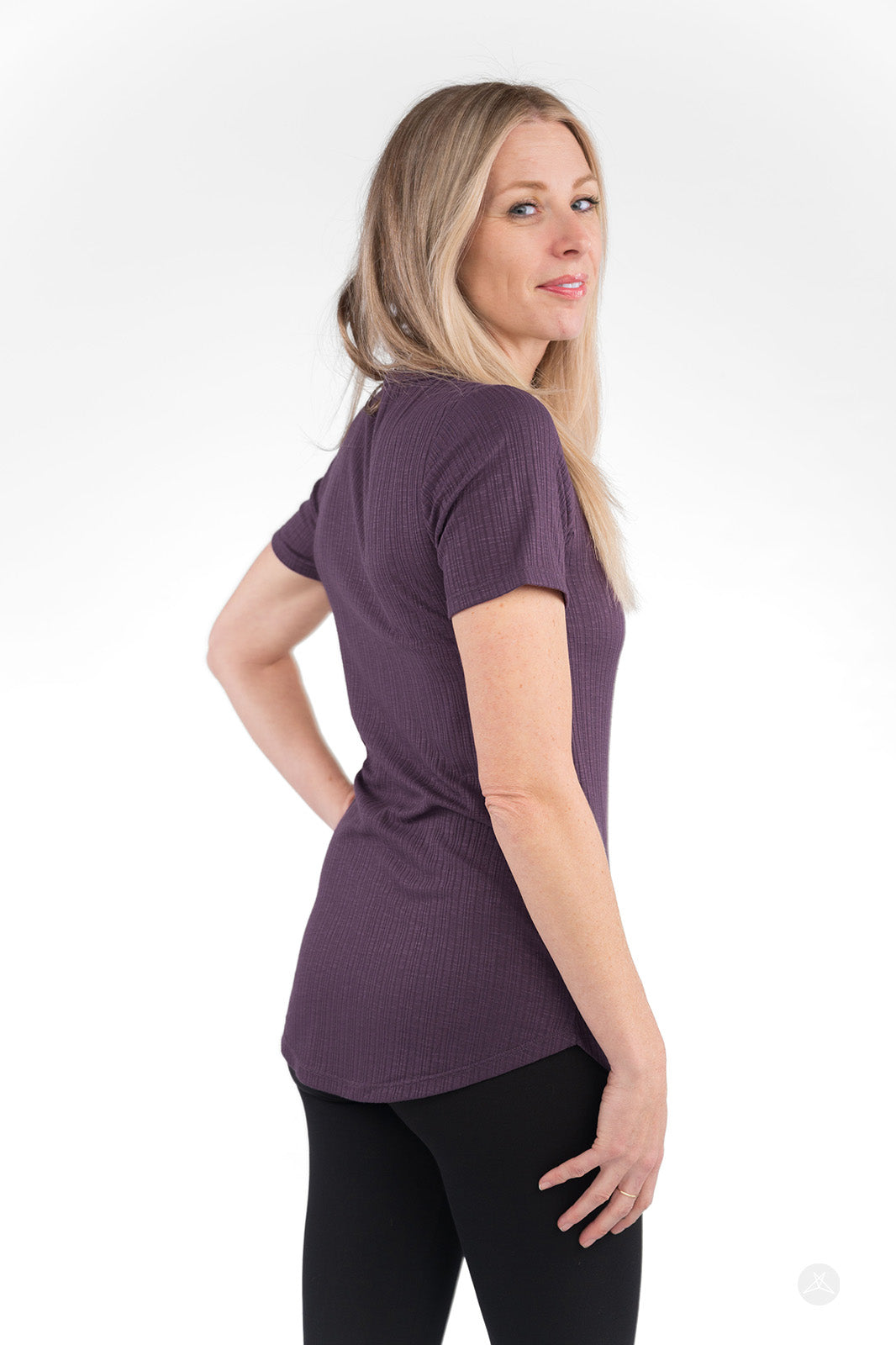 Rear angle of woman wearing purple The Soft Ribbed Tee with short sleeves by SweetLegs Canada