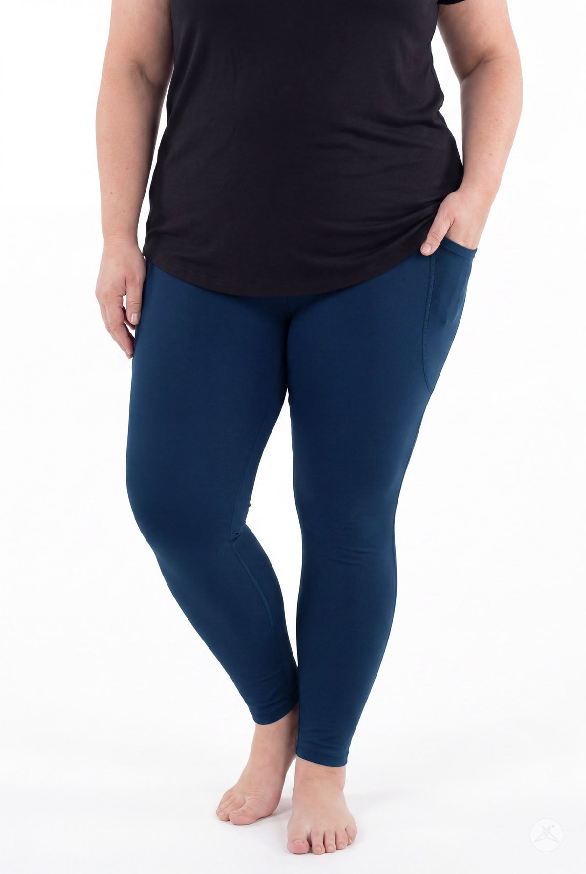 SweetLegs Still Water Pocket Leggings in navy blue worn by a model with side pockets