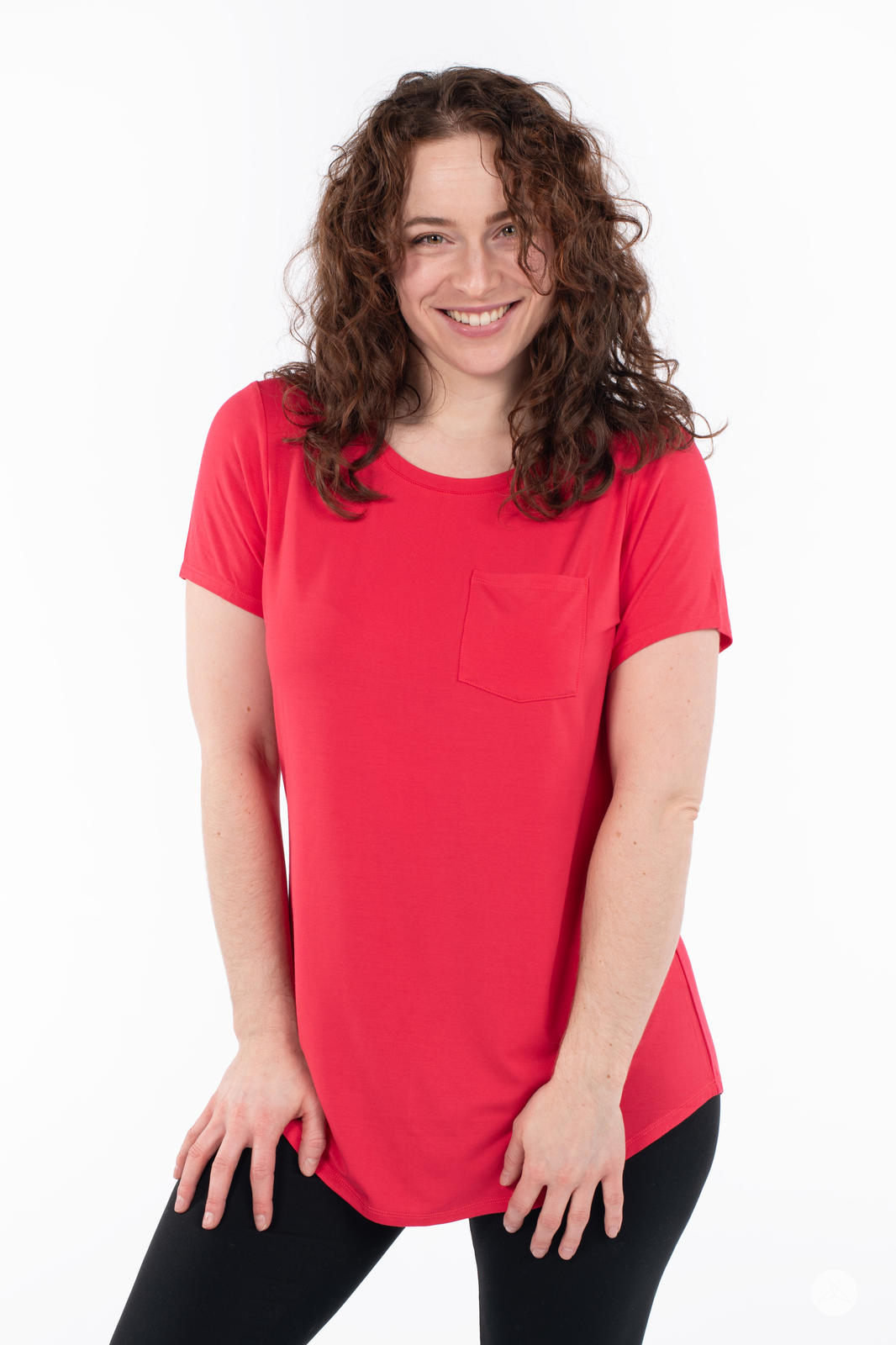 Woman smiling wearing SweetTops Crew Neck Pocket Tee in vibrant red with short sleeves and front pocket detail