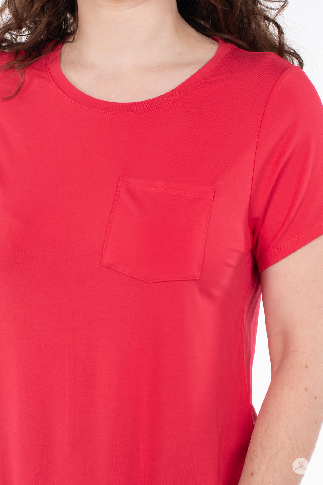 Close-up of woman wearing SweetTops Crew Neck Pocket Tee in vibrant red with soft fabric and classic pocket design
