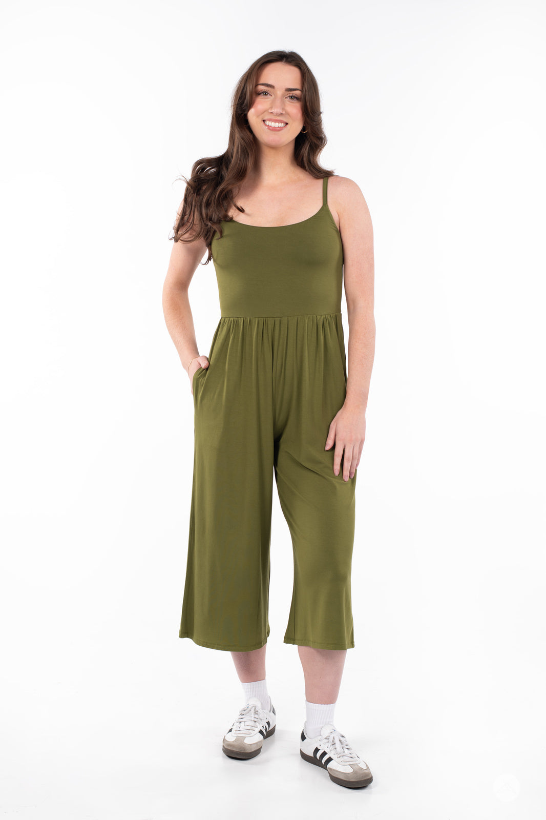 Woman smiling wearing SweetLegs Cropped Wide Leg Jumpsuit in olive green with scoop neck and side pockets