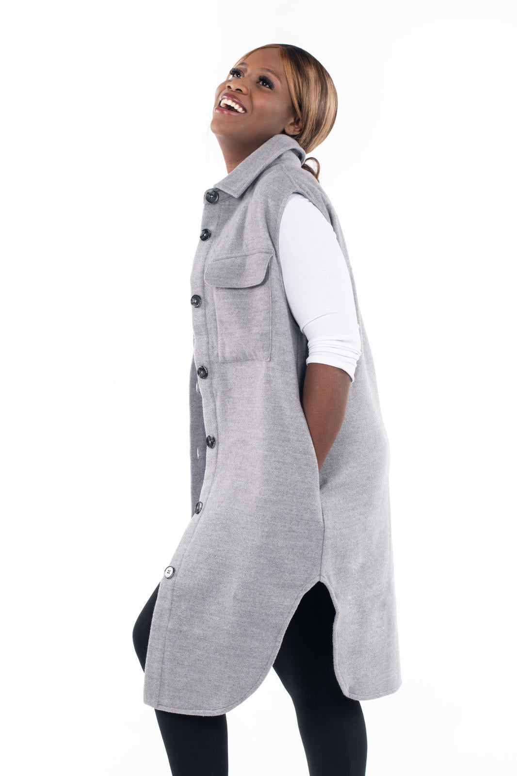 Model wearing SweetLegs Canada Layering Shacket Vest in soft grey woven fabric with button-up front and flap pockets