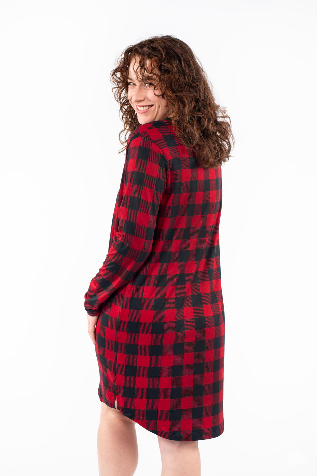 Smiling woman modeling SweetTops Henley Sleep Shirt in red and black buffalo plaid with relaxed fit back view