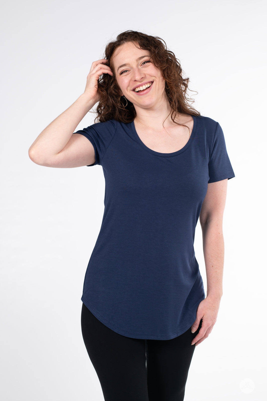 Smiling woman wearing SweetLegs Canada Scoop Neck Tee in navy with curved hem and short sleeves front view