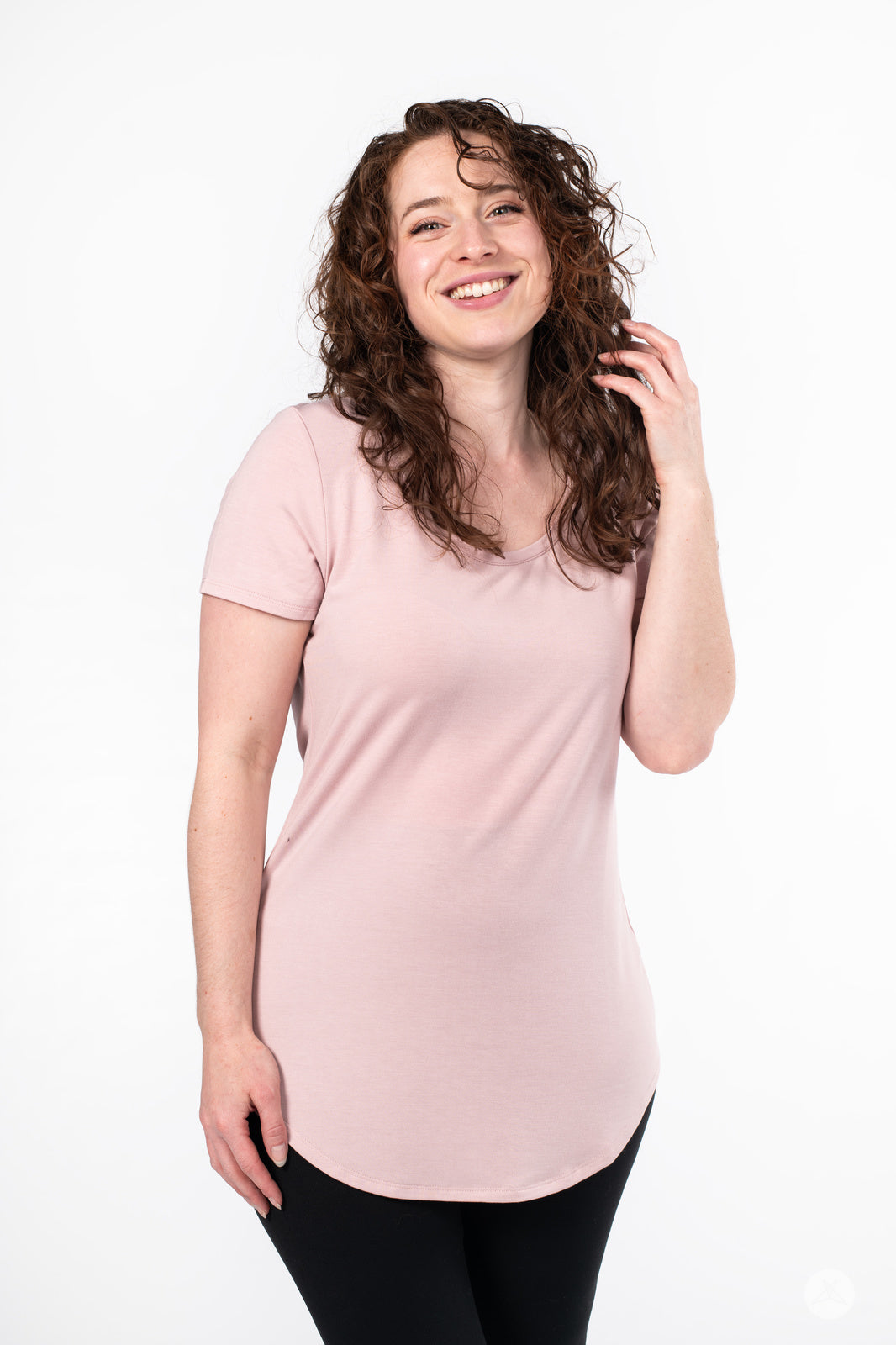 Smiling woman wearing SweetLegs Canada Scoop Neck Tee in soft pink with curved hem and short sleeves front view