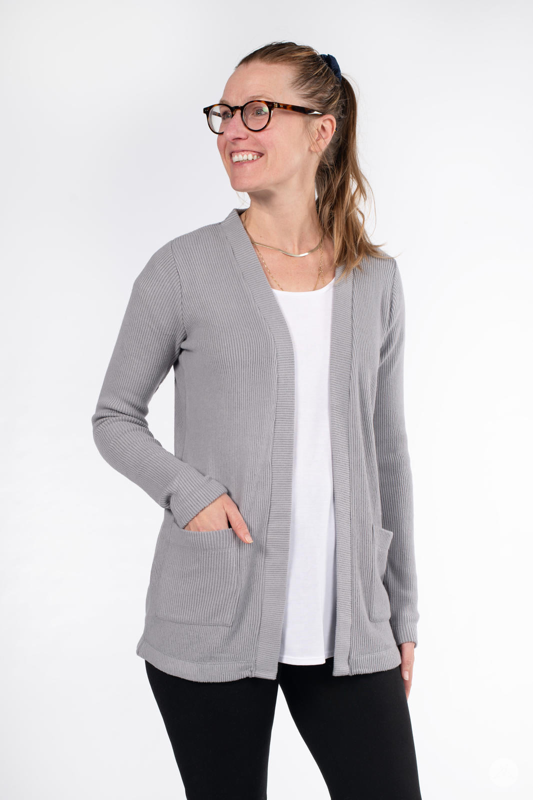 Woman smiling wearing SweetLegs Canada Ribbed Comfort Cardigan in grey with front pockets and relaxed fit
