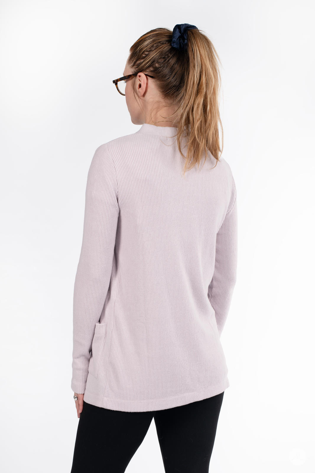 Back view of woman wearing SweetLegs Canada Ribbed Comfort Cardigan in light dusty pink with long sleeves and pockets