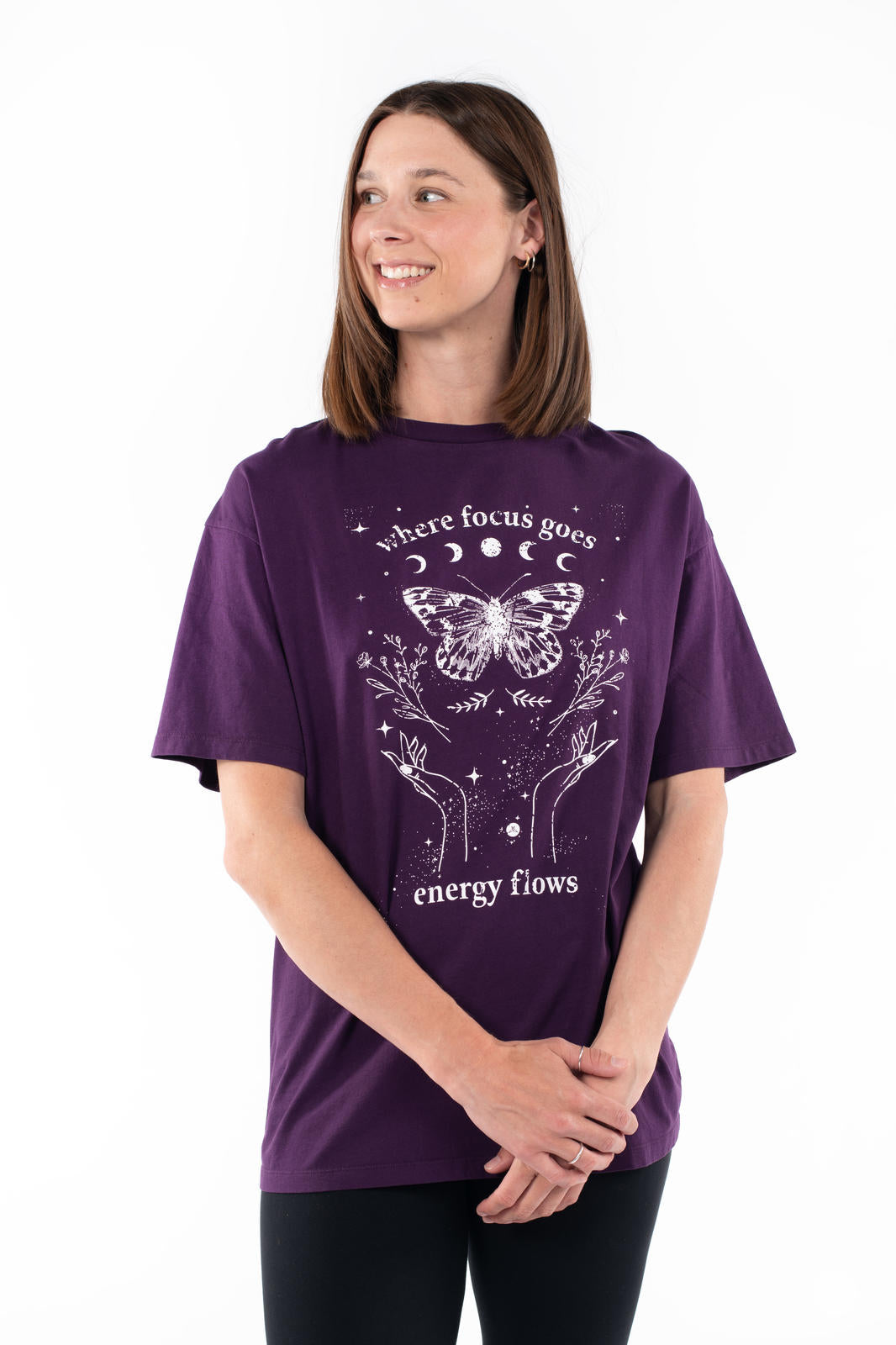 Woman wearing purple SweetTops Vintage Graphic Tee with mystical butterfly and floral design and positive affirmation text