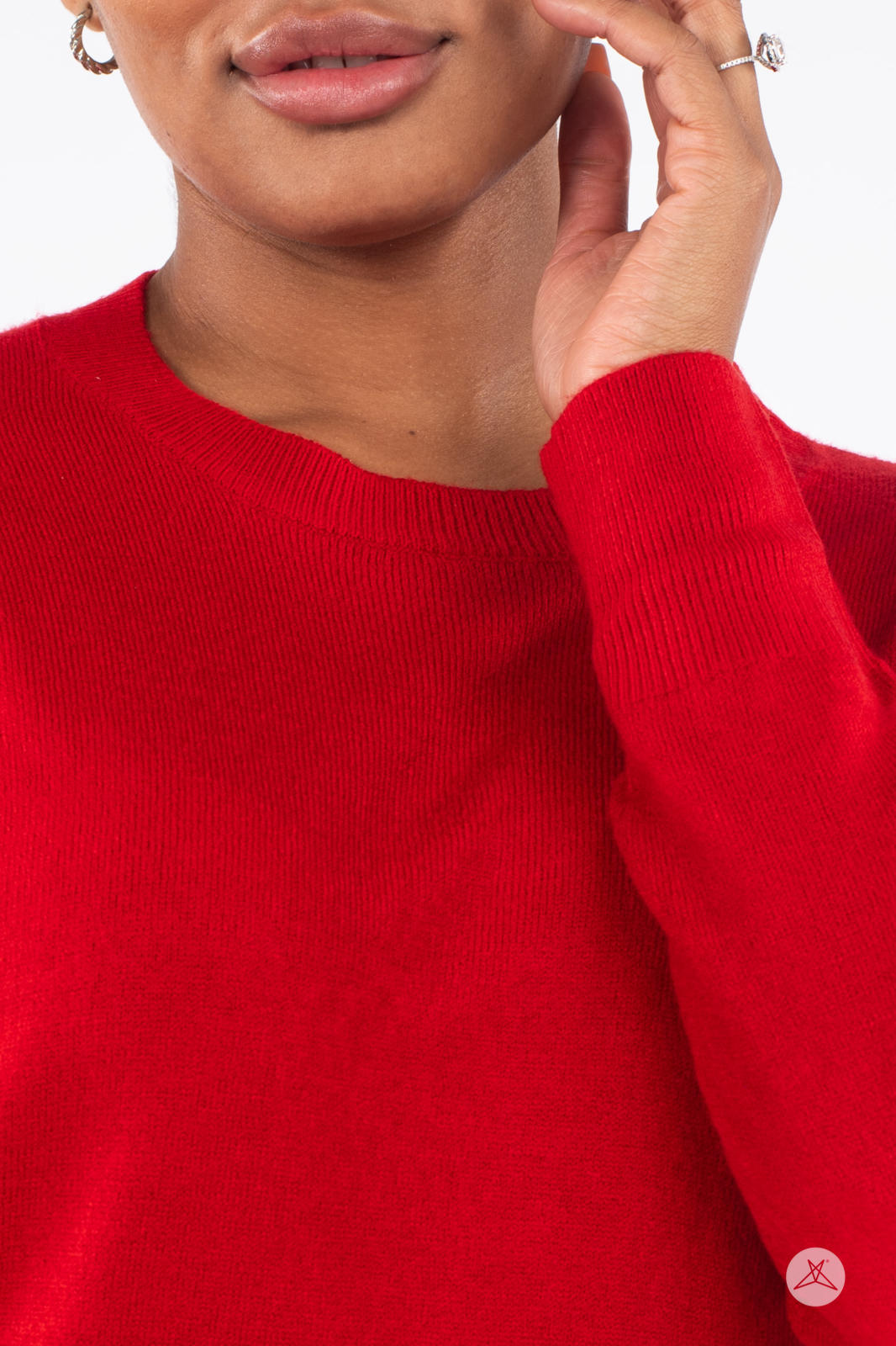 Close-up of woman wearing SweetTops Soft Knit Crew Neck Sweater in bright red with ribbed neckline and cuff detail