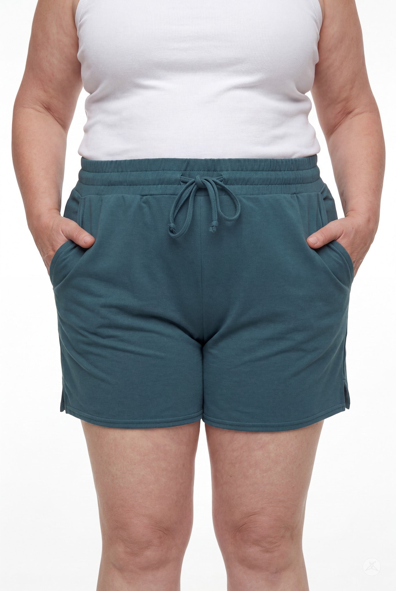 Front view of person wearing teal Lounge Shorts by SweetLegs with elastic waistband, drawstring, and pockets with hands inside