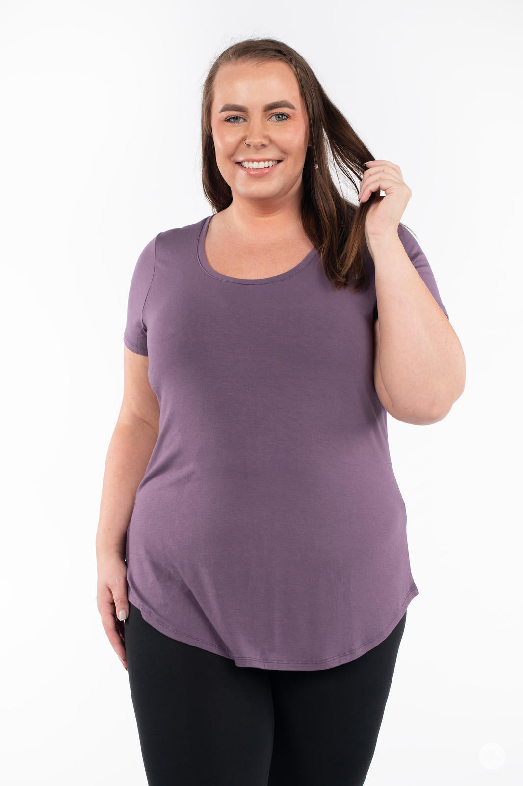 Plus-size woman wearing SweetLegs Canada Scoop Neck Tee in soft purple with short sleeves and curved hem front view
